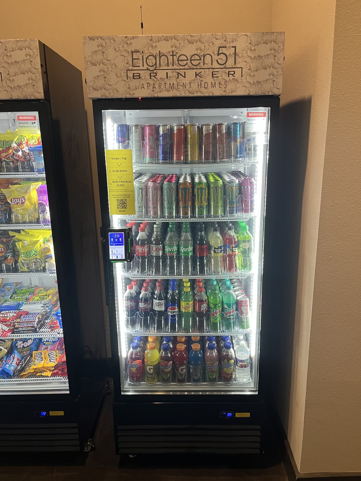 Smart vending cooler stocked with drinks and snacks